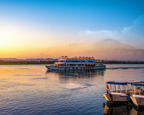River,Nile,And,Ship,At,Sunset,In,Aswan