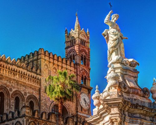 Sculpture,In,Front,Of,Palermo,Cathedral,Church,Against,Blue,Sky,