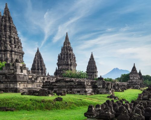 Ancient,Stone,Ruins,On,Green,Field,And,Candi,Prambanan,Or
