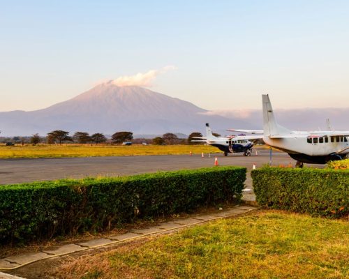 Small,Propeller,Airplanes,At,Airport,At,Sunset,,Mount,Meru,At