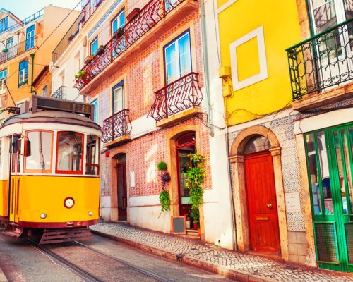 Yellow,Vintage,Tram,On,The,Street,In,Lisbon,,Portugal.,Famous